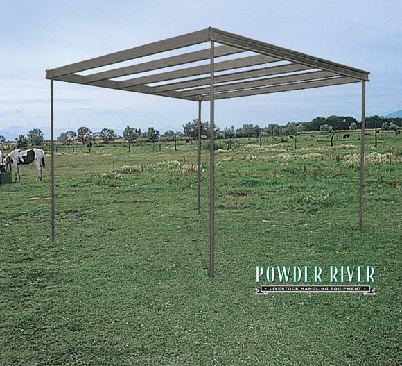 horse shelter set up in field without roof