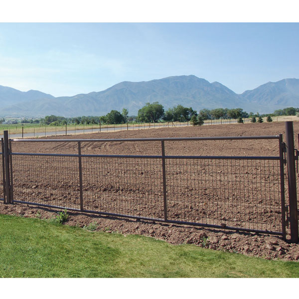 wire filled panel being used as a gate on a farm