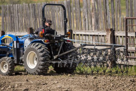 tractor using a garden harrow