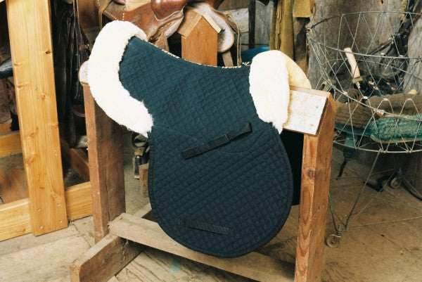sheepskin saddle pad in English style with black quilting