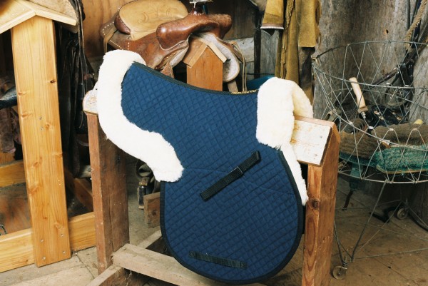 contoured sheepskin saddle pad with pommel and cantle roll