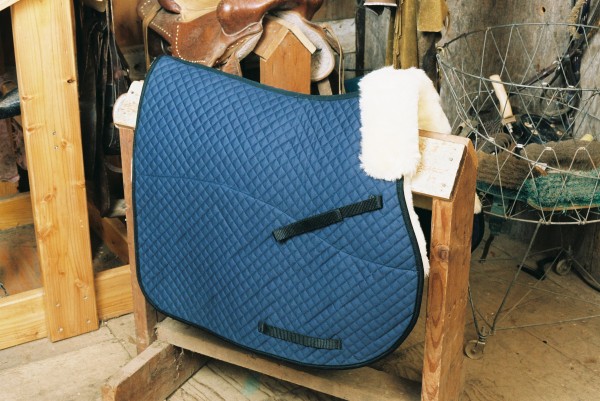 full length saddle pad with a pommel roll and partial lining