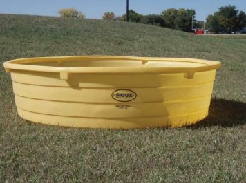 poly water tank in pasture
