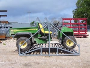 side view of atv on a cattle guard