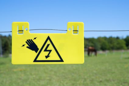 electric fence warning sign in yellow