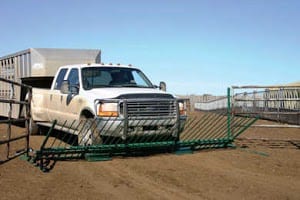 truck driving over a livestock gate