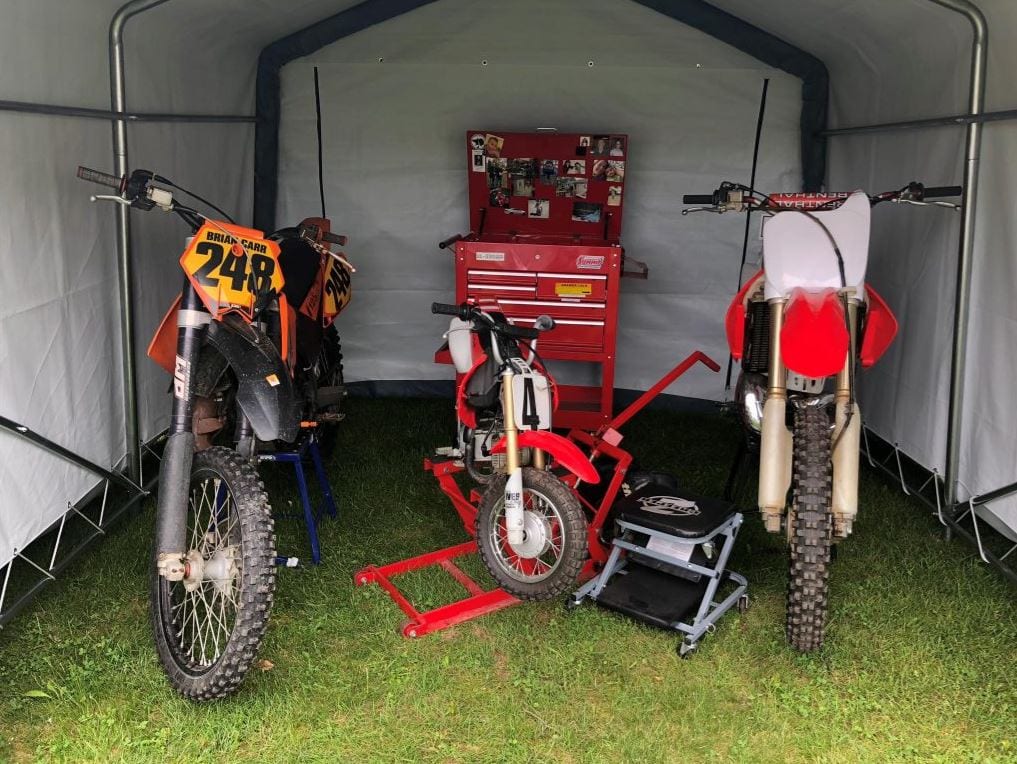 portable storage shed with motorcycles inside