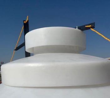 Close-up of poly grain bin vented lid showing vent slots and rope-pull hinge mechanism