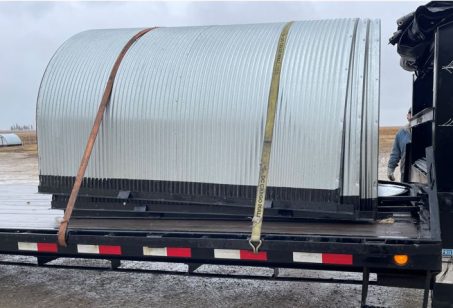 animal shelters loaded on a trailer for delivery