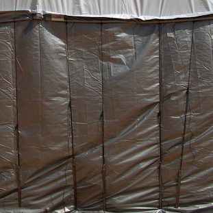 side curtain installed on a square bale haystack
