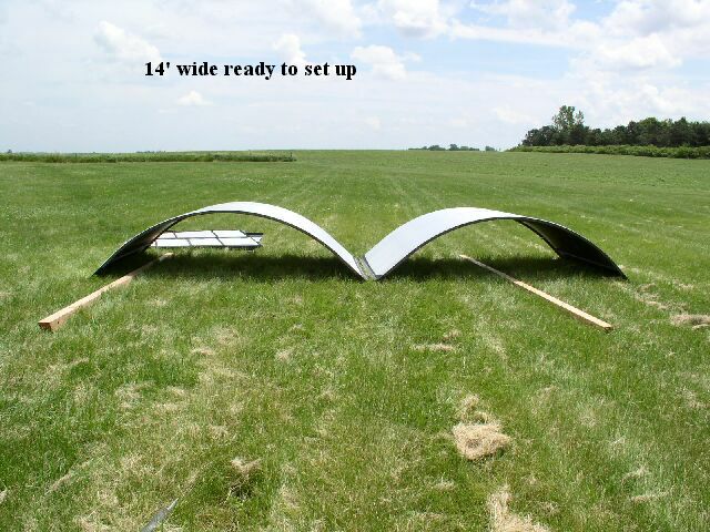 the building wall sections laying in the grass for assembly