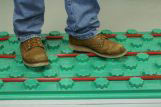 man standing on a floor insulation panel