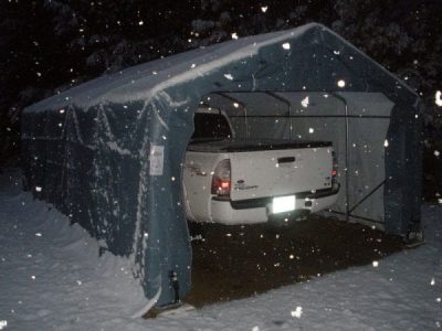 truck inside instant garage during snowfall