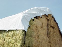 a hay tarp covering square hay bales